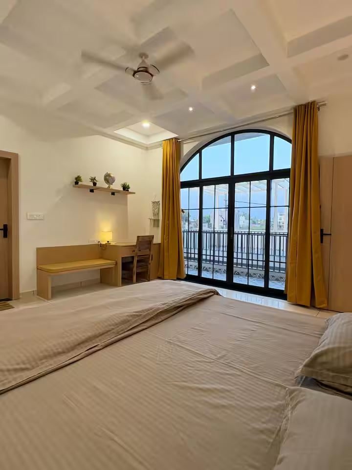 Bedroom 3 — AC bedroom with closet, attached washroom with geyser, and a study table with small sitting